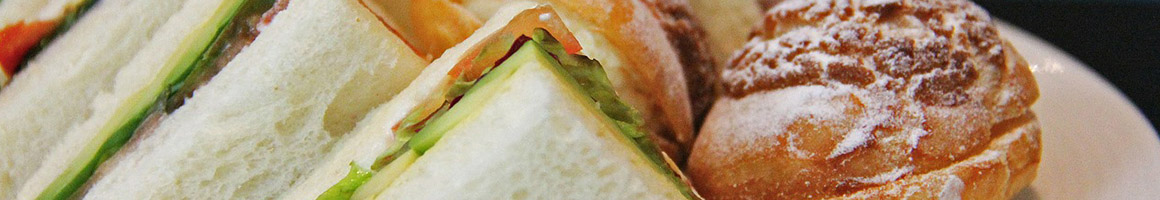 Eating Sandwich Bakery at Parisi Bakery & Deli restaurant in New York, NY.